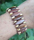 Bracelet of pointed rosewood and purpleheart beads with cream accents